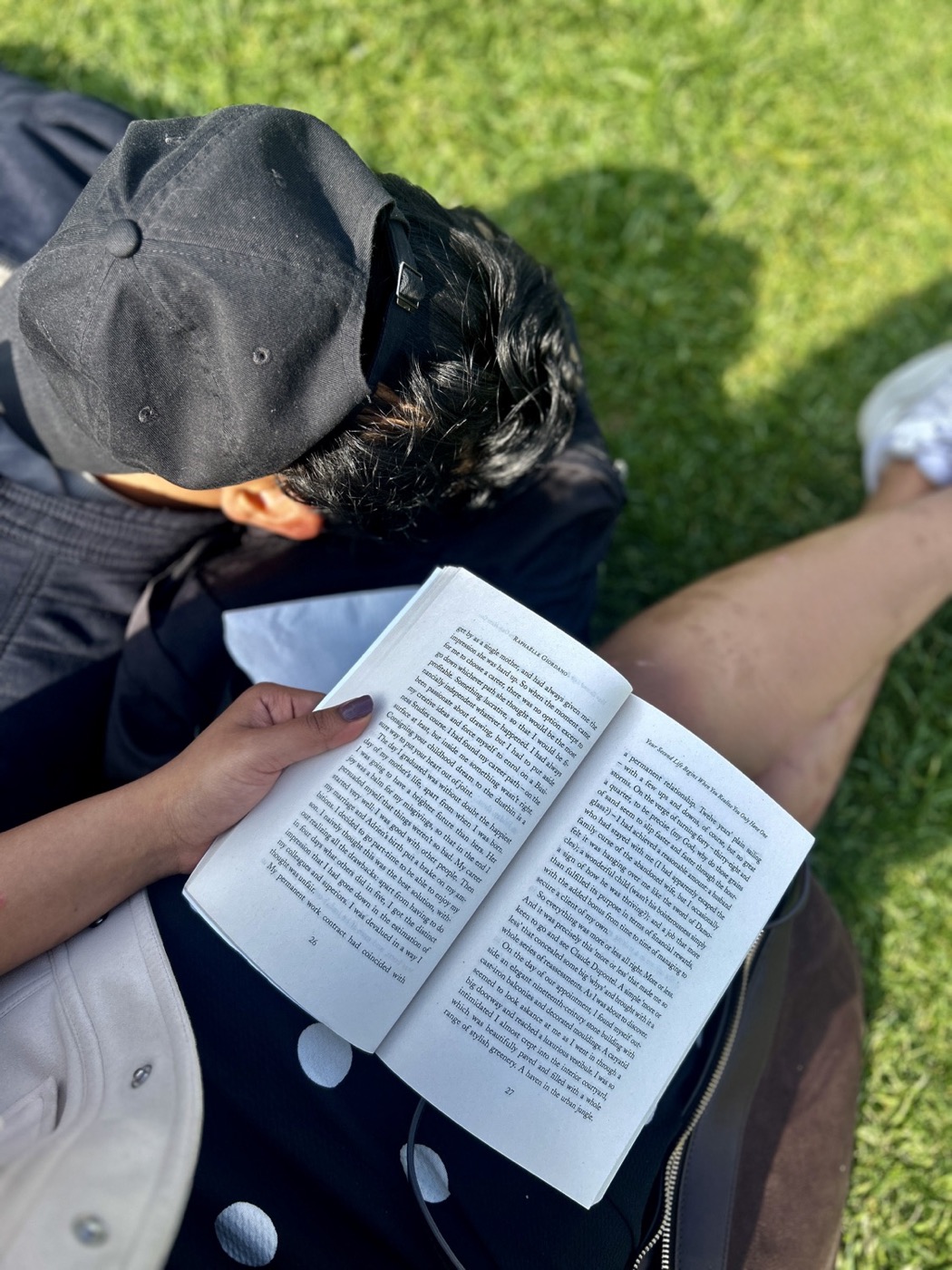 Held by the page, photograph.