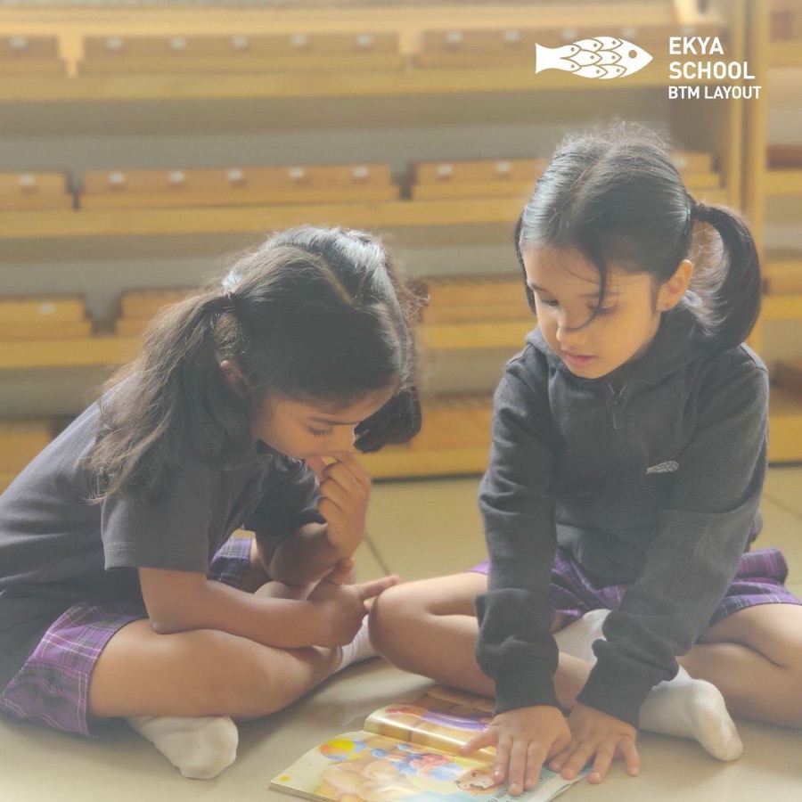 Instagram post, Ekya School BTM Layout, two children reading together